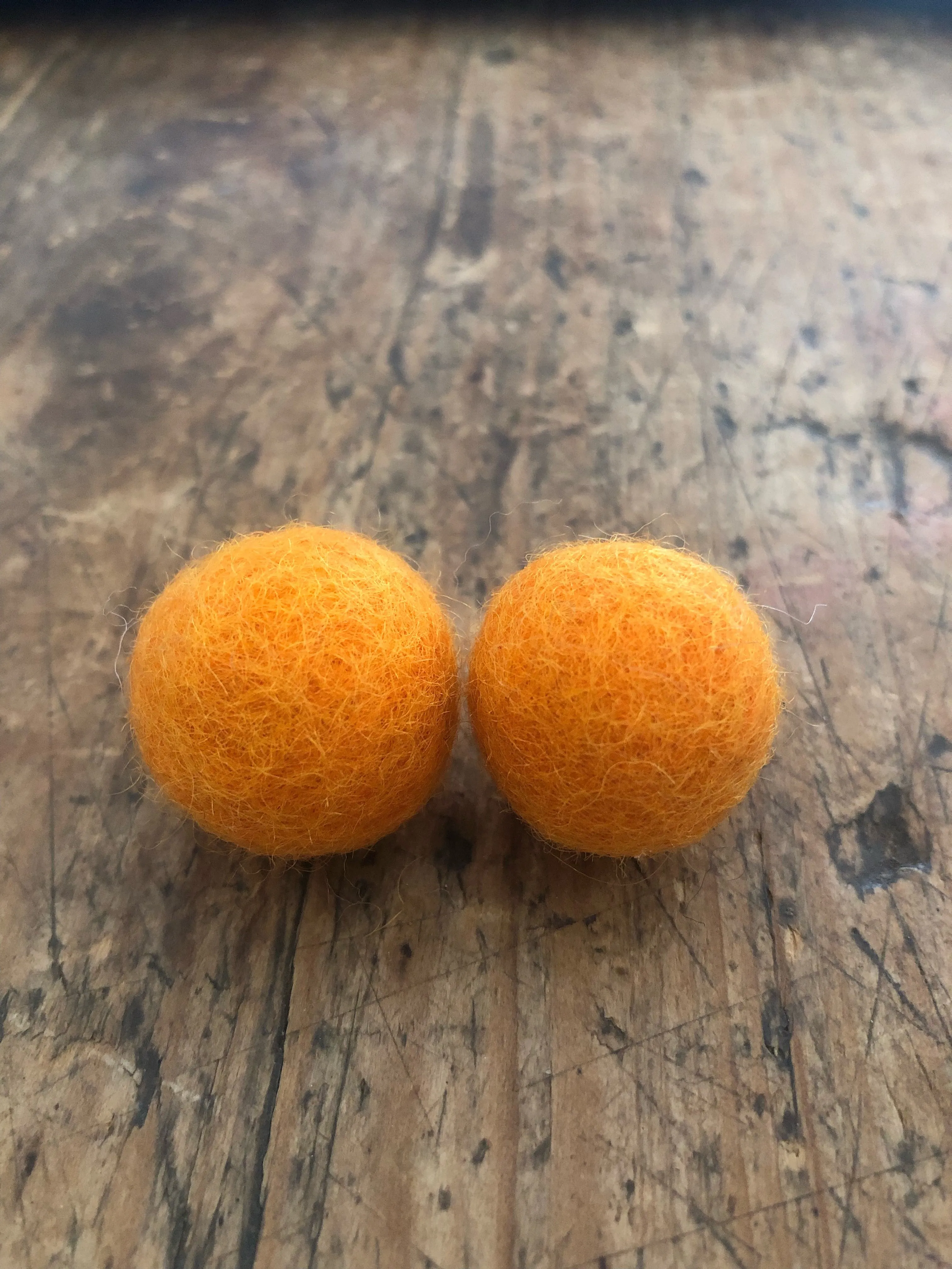 Large felt ball earrings